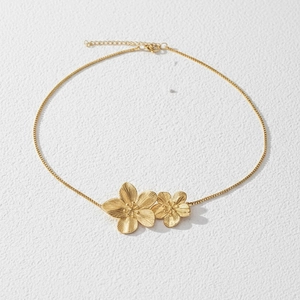 Vintage gold stainless steel necklace featuring a large double layered flower pendant