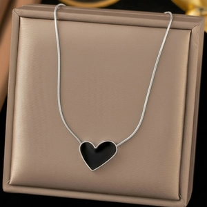 18K silver-plated snake chain necklace with a black enamel heart pendant in a jewelry box