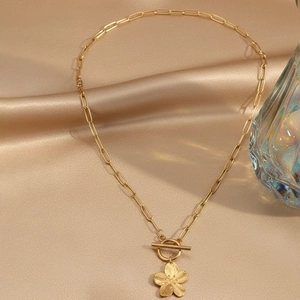 Gold stainless steel flower pendant necklace with paperclip chain and T-bar toggle clasp