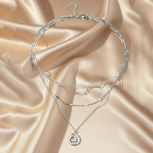 Three-layer stainless steel necklace featuring paperclip chain and spiral ring pendant