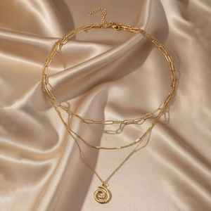 Three-layer gold stainless steel necklace with paperclip chain and spiral pendant
