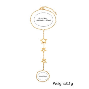 Detail of gold star slave bracelet showing dimensions 17cm+5cm and 8cm ring size