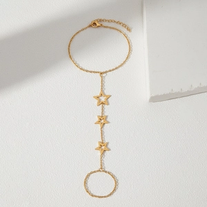 Elegant gold hollow star hand harness bracelet featuring minimalist finger ring design