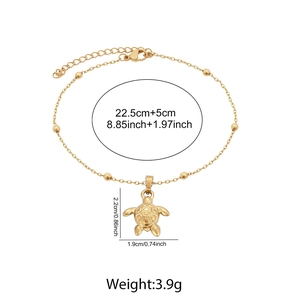 Detailed size and weight specs for gold turtle pendant anklet with measurements labels