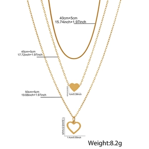 Detailed view of 18K gold layered necklace set with heart charms and exact dimensions