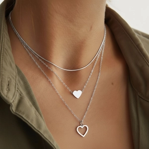 Three-layer stainless steel necklace featuring a snake chain and double heart pendants