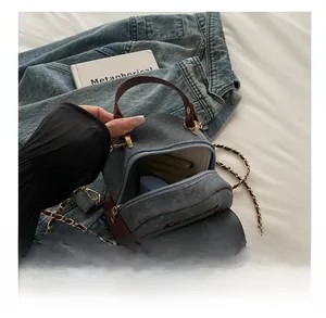 Interior capacity view of a mini denim backpack showing storage space and lining
