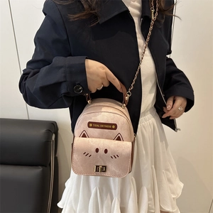 Chic pink cat-shaped mini backpack for women featuring cute ears and metallic chain strap