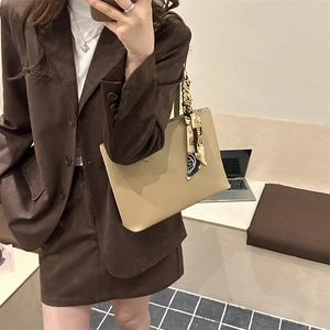 Minimalist khaki leather tote bag with decorative scarf for women's office commuting