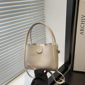 Chic cream small bucket tote bag in premium faux leather with dual round handles
