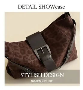 Detail of leopard print tote bag with brown leather strap and silver buckle accent