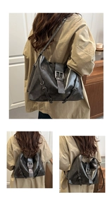 Detail view of large leopard trim crossbody backpack showing versatile wearing styles