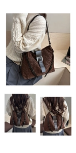 Detail of dark brown leopard print suede bag with vintage silver buckle and leather straps
