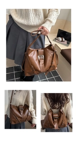 Detail showing the adjustable straps and silver buckle on this large brown leather tote
