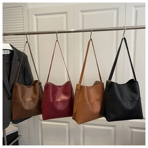 Detailed comparison of minimalist bucket bags in brown, burgundy, tan and black colors