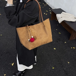 Large capacity brown suede tote bag with decorative pompom and slim straps for autumn