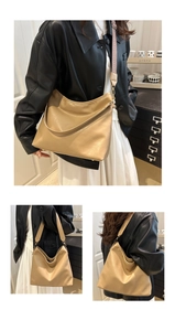 Detail view of khaki hobo tote bag featuring detachable wide woven and slim leather straps