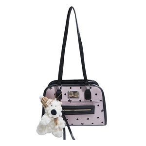 Vintage pink polka dot tote bag with black leather trim and cute plush bear charm