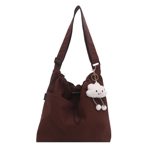Large dark brown nylon tote bag with drawstring detail and cloud charm for daily commute