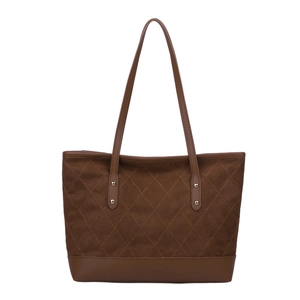 Vintage brown large tote bag with quilted suede texture and leather shoulder straps