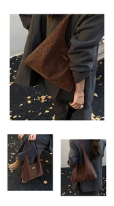 Close-up of vintage faux suede leopard print hobo bag with embossed matte leather texture
