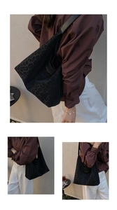 Detailed close-up of the black leopard pattern nylon tote bag with leather shoulder strap