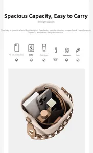 Top view of beige bucket bag showing spacious interior with phone and makeup essentials