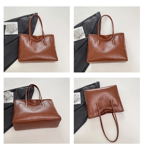 Vista dettagliata della borsa tote marrone in ecopelle con trama naturale e cuciture rinforzate