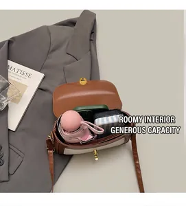 Top-down view of retro crossbody bag showing spacious interior with daily essentials