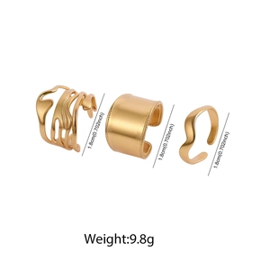 Detailed view of three wide gold-plated stainless steel open rings with 1.8cm height