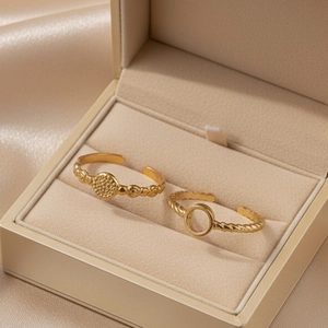 Luxury gold adjustable ring set with textured and twisted rope patterns in a gift box