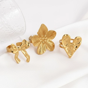 Three-piece gold stainless steel ring set with flower heart and bow designs