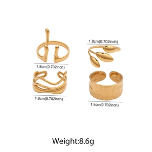 Detailed set of four gold stainless steel rings featuring wave and textured patterns