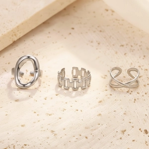 Set of three silver stainless steel minimalist rings with chain and geometric designs