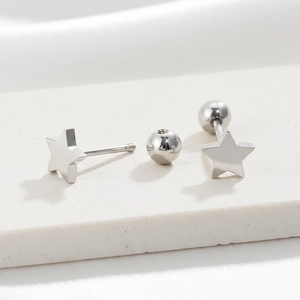 Detailed macro view of star shaped stainless steel studs with secure screw ball backings
