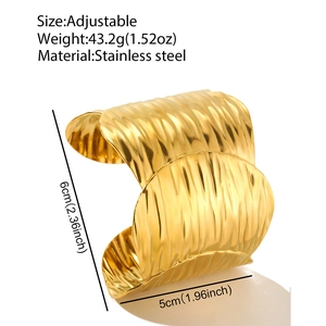 Adjustable wide wave-textured gold stainless steel bangle showing weight and size specs