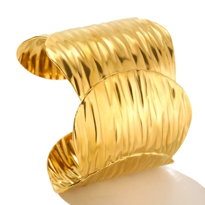 18K gold-plated adjustable stainless steel cuff bracelet featuring a wide wavy texture