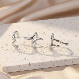Minimalist silver fluid metal ring set with irregular liquid lava style open design
