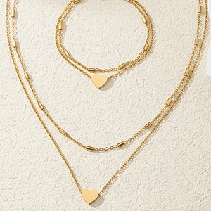 Parure de bijoux en acier inoxydable doré 18K avec collier et bracelet à cœur