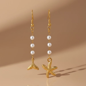 Asymmetric gold starfish and fishtail pearl drop earrings with matte metal texture