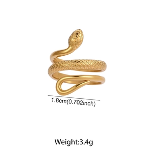 Macro shot of gold snake spiral ring with detailed scale texture and 1.8cm diameter