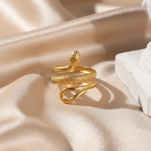 Detailed macro view of 18k gold-plated snake ring with intricate diamond-scale texture