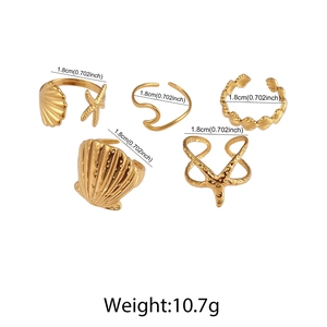 Detailed size chart showing 1.8cm diameter for gold starfish and shell ring set