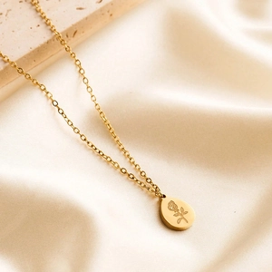 18K gold plated stainless steel oval rose pendant necklace on soft beige silk