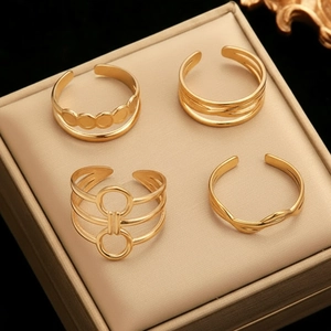 Set of four 18K gold plated stainless steel geometric open rings in jewelry display box