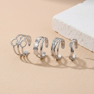 Set of four adjustable silver stainless steel rings with geometric hollow design