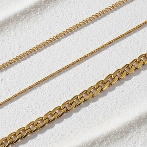 18K gold plated stainless steel curb and box chain bracelet set for women on white sand