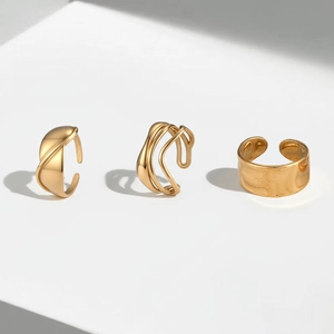 Three-piece 18k gold-plated stainless steel open ring set with irregular textured surfaces