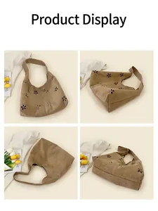 Détails du sac fourre-tout en daim marron avec motifs floraux découpés au laser sous angles