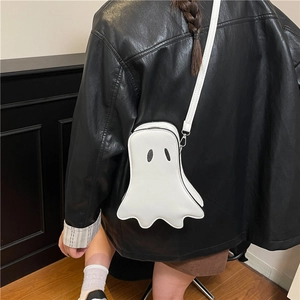 Cute white cartoon ghost crossbody bag with matte finish shown on a black leather jacket